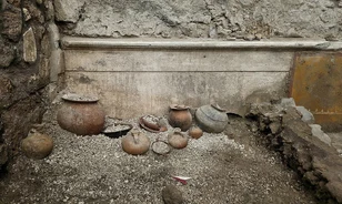 Pompeii cupboard yields childhood charms and coins